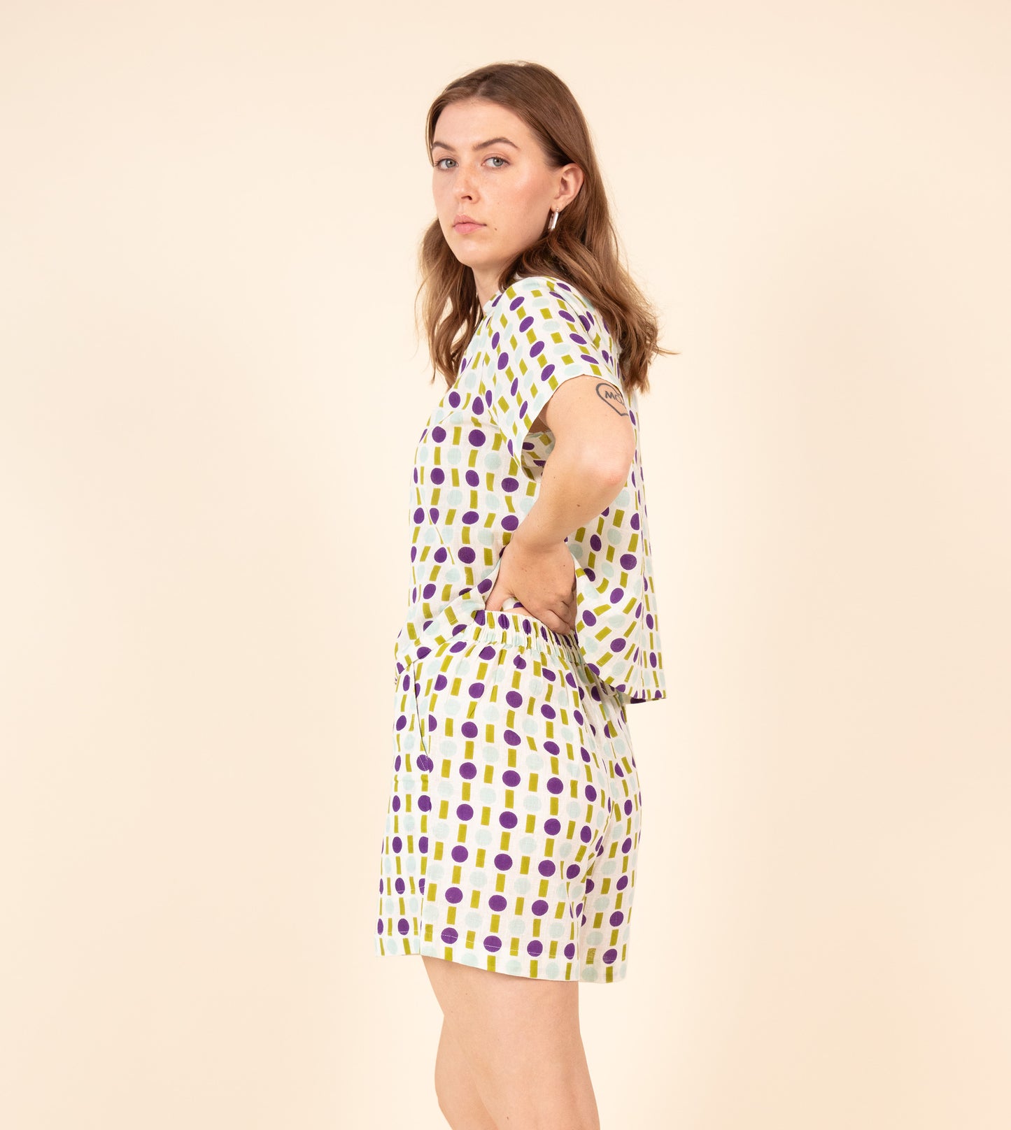 Ren Shorts Green Purple | Harkoi Studio - Make a bold statement with the Ren Shorts in green & purple. Keywords: sustainable shorts, eco-friendly fashion, Ren Shorts, green & purple shorts, ethical clothing.