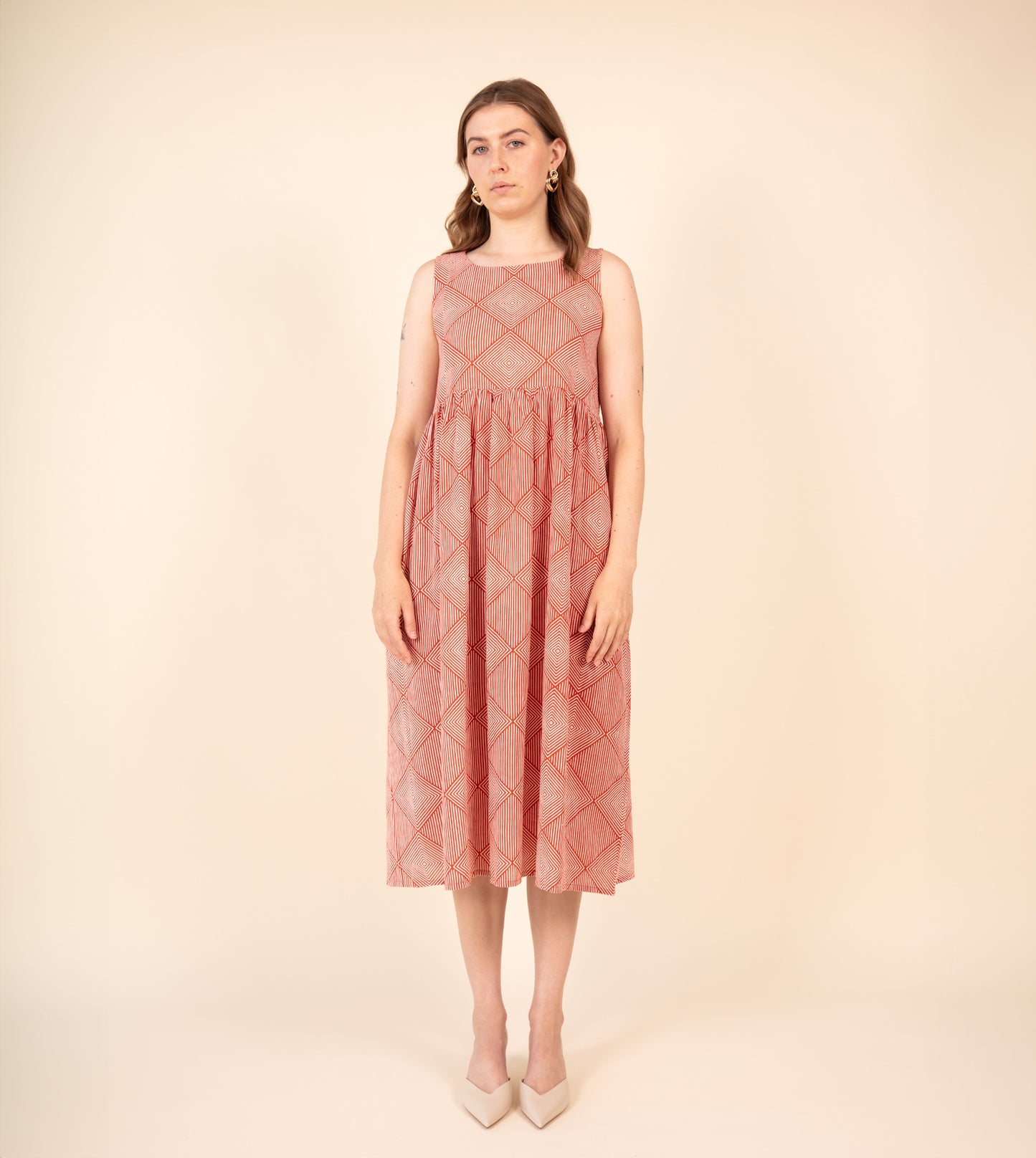 Suki Dress Orange | Harkoi Studio - Brighten your wardrobe with the Suki Dress in vibrant orange. Keywords: sustainable dress, eco-friendly fashion, Suki Dress, orange dress, ethical clothing.