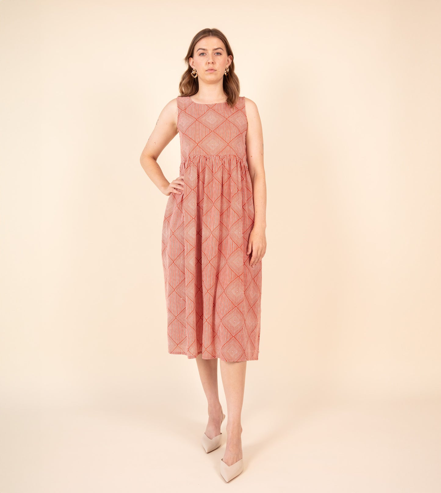 Suki Dress Orange | Harkoi Studio - Brighten your wardrobe with the Suki Dress in vibrant orange. Keywords: sustainable dress, eco-friendly fashion, Suki Dress, orange dress, ethical clothing.
