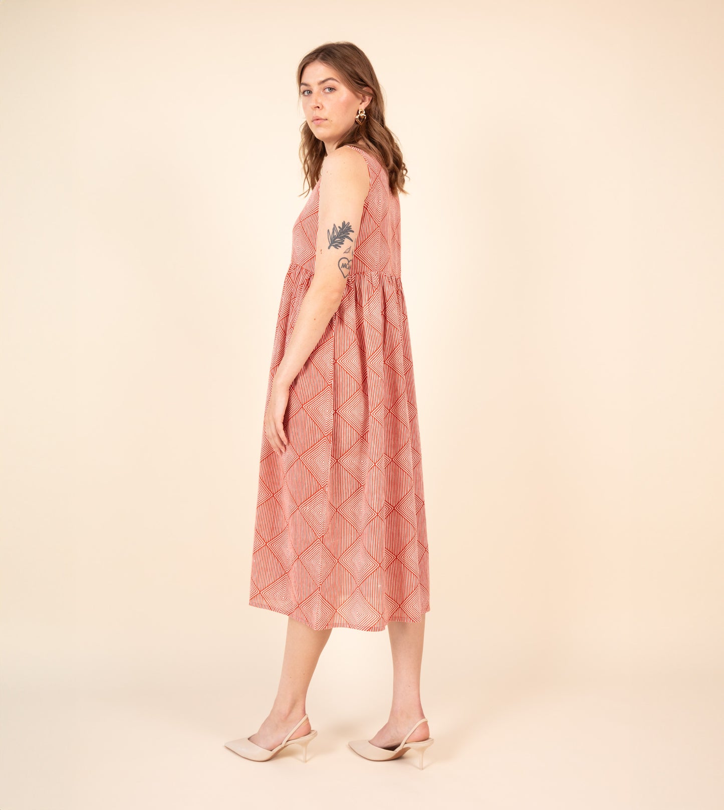 Suki Dress Orange | Harkoi Studio - Brighten your wardrobe with the Suki Dress in vibrant orange. Keywords: sustainable dress, eco-friendly fashion, Suki Dress, orange dress, ethical clothing.