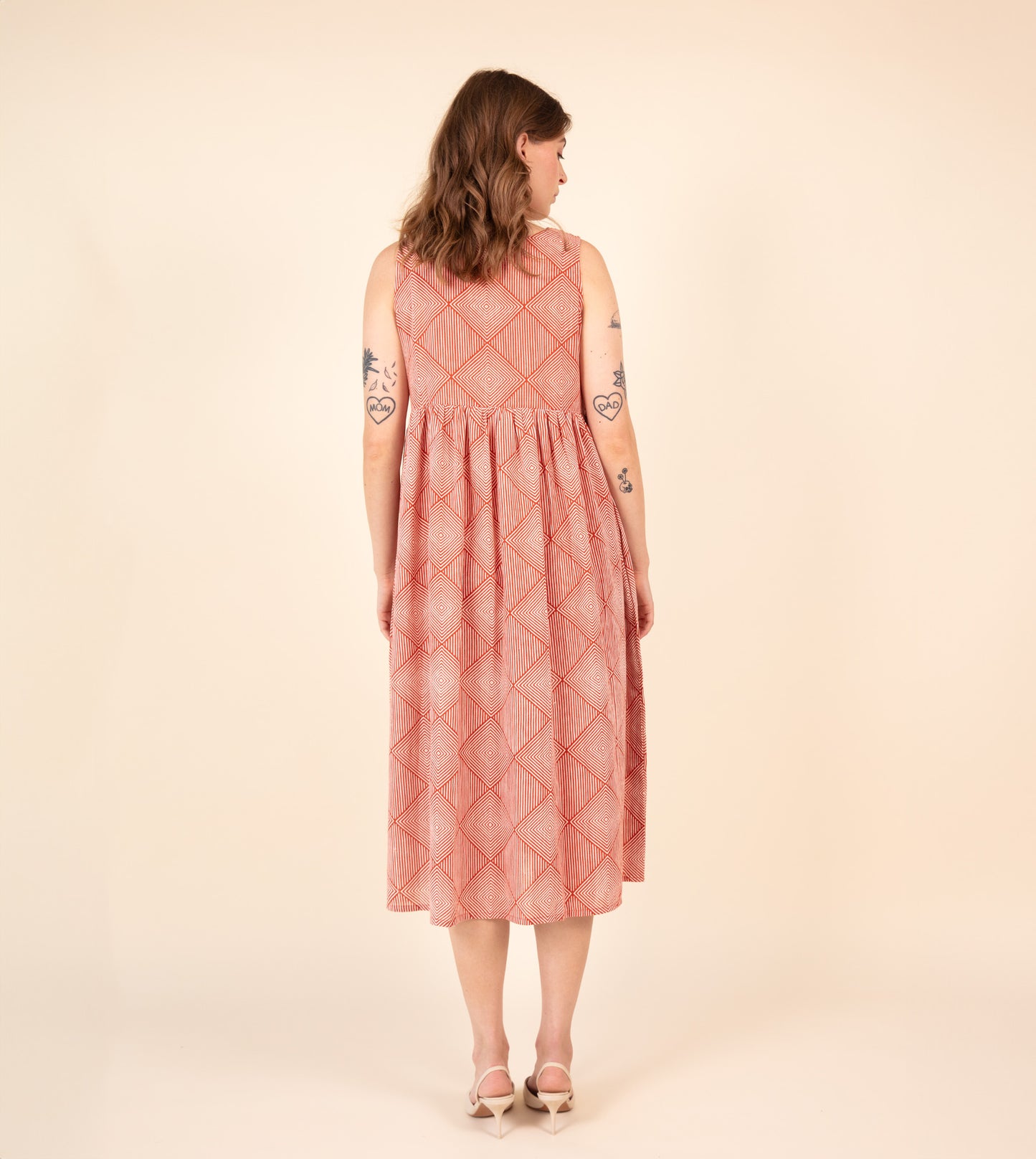 Suki Dress Orange | Harkoi Studio - Brighten your wardrobe with the Suki Dress in vibrant orange. Keywords: sustainable dress, eco-friendly fashion, Suki Dress, orange dress, ethical clothing.