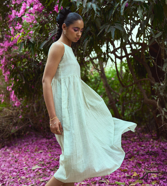 Sleeveless khadi cotton midi dress with sketchy check embroidery and hand-stitched motif, handcrafted in India.