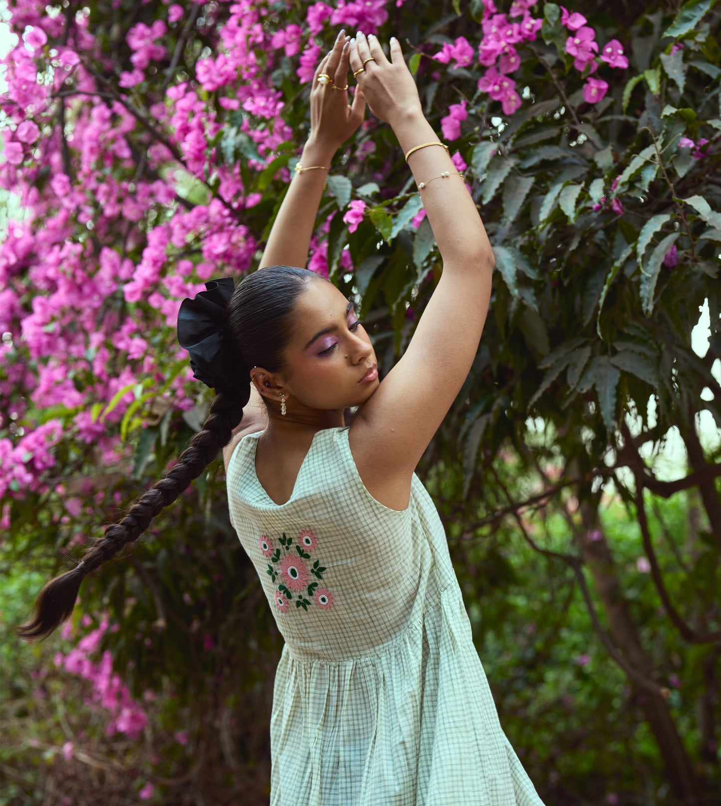 Sleeveless khadi cotton midi dress with sketchy check embroidery and hand-stitched motif, handcrafted in India.