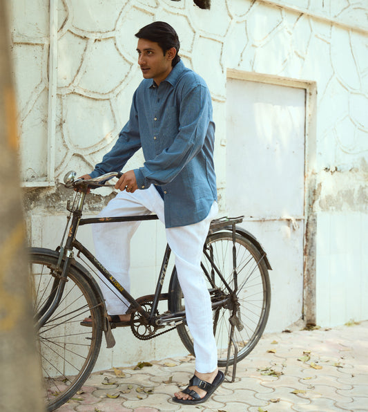 Men’s pinstriped khadi cotton full-sleeve shirt with corozo buttons, suitable for casual or formal looks.