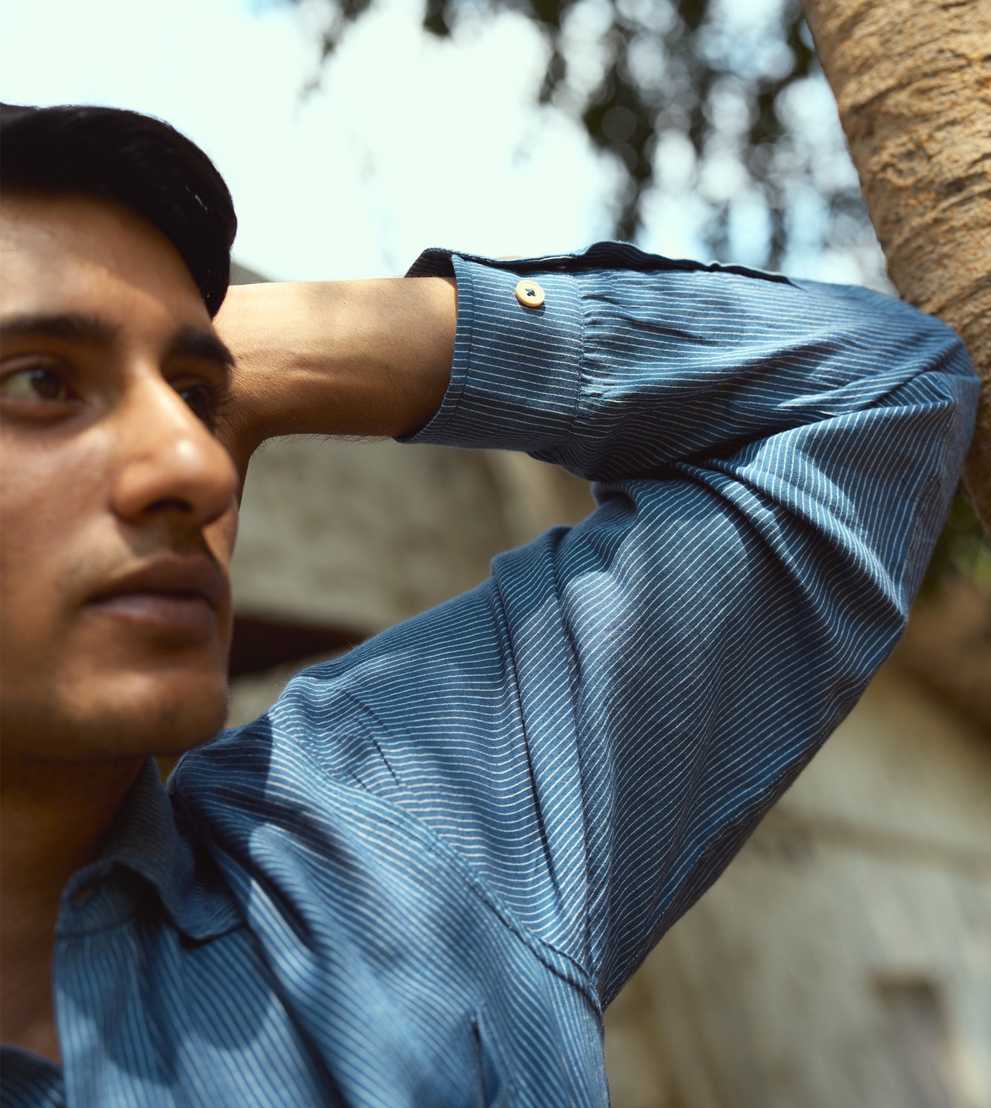 Men’s pinstriped khadi cotton full-sleeve shirt with corozo buttons, suitable for casual or formal looks.