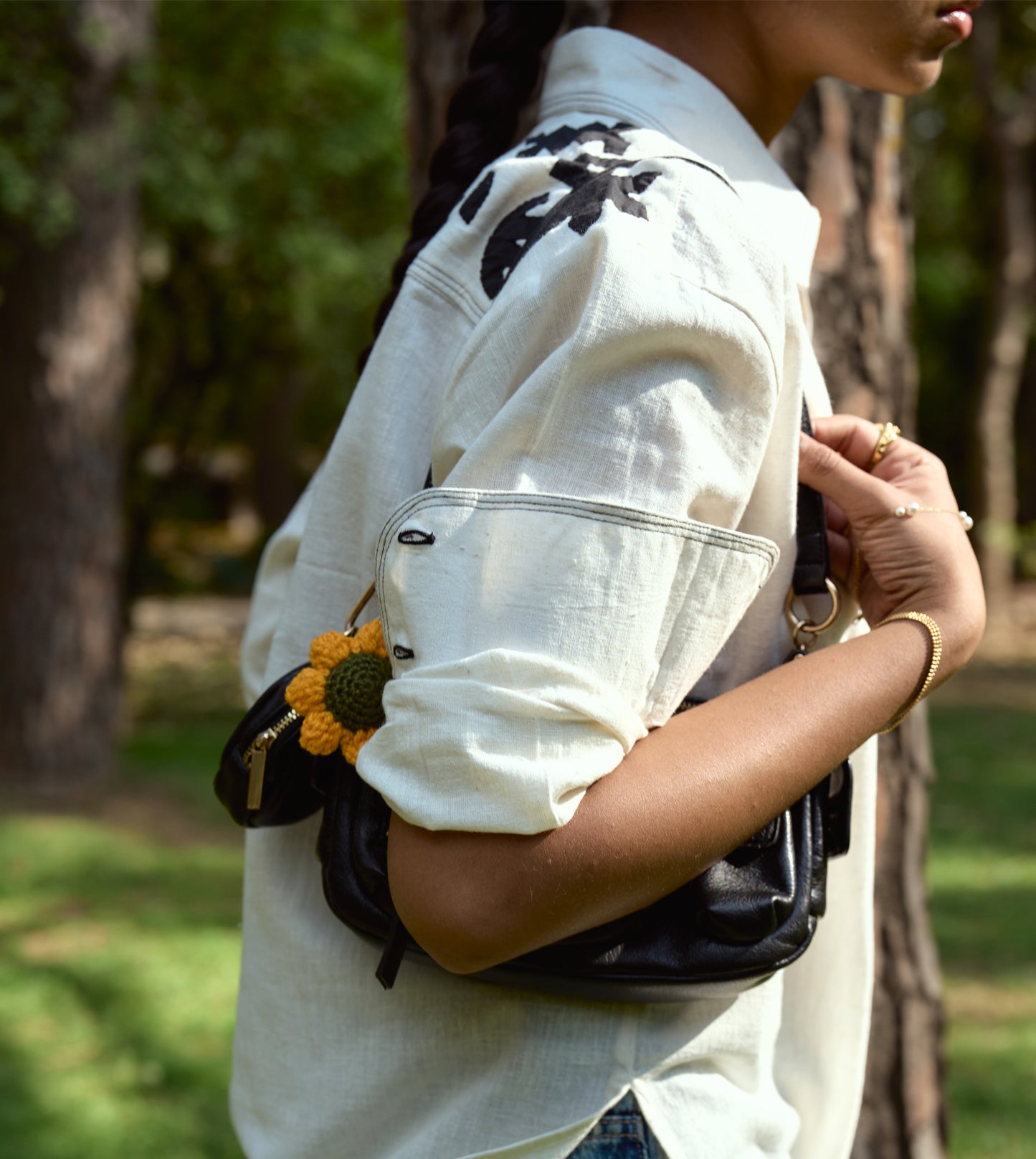 Full-sleeve kala cotton shirt with hand-stitched appliqué patterns and corozo buttons, relaxed fit.