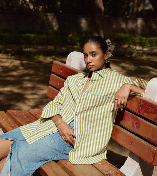 Block-printed striped kala cotton shirt with brass buttons, blue embroidery, and a relaxed fit.