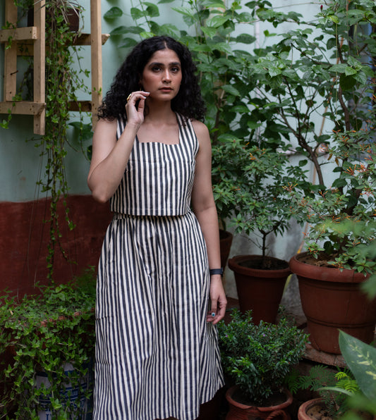 Stripes Yoko Skirt in Black ? a paneled, long sustainable cotton skirt with an elastic waistband and pockets. Made from organic, hand-loomed 'kala' cotton in India.