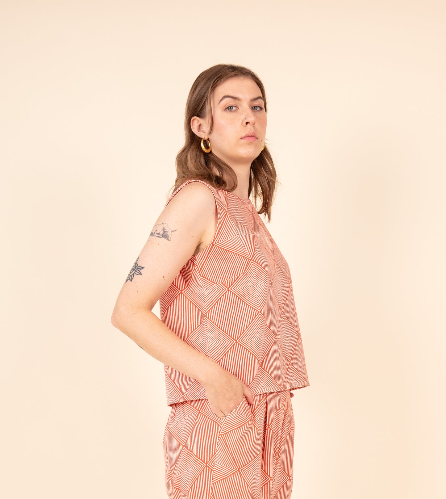 Radiate Akira Top Orange | Harkoi Studio - Elevating traditional patterns with a modern edge, the Radiate Akira, a sustainable- with precision and care. Keywords: radiate, akira, top, orange, sustainable orange, eco-friendly fashion, top.