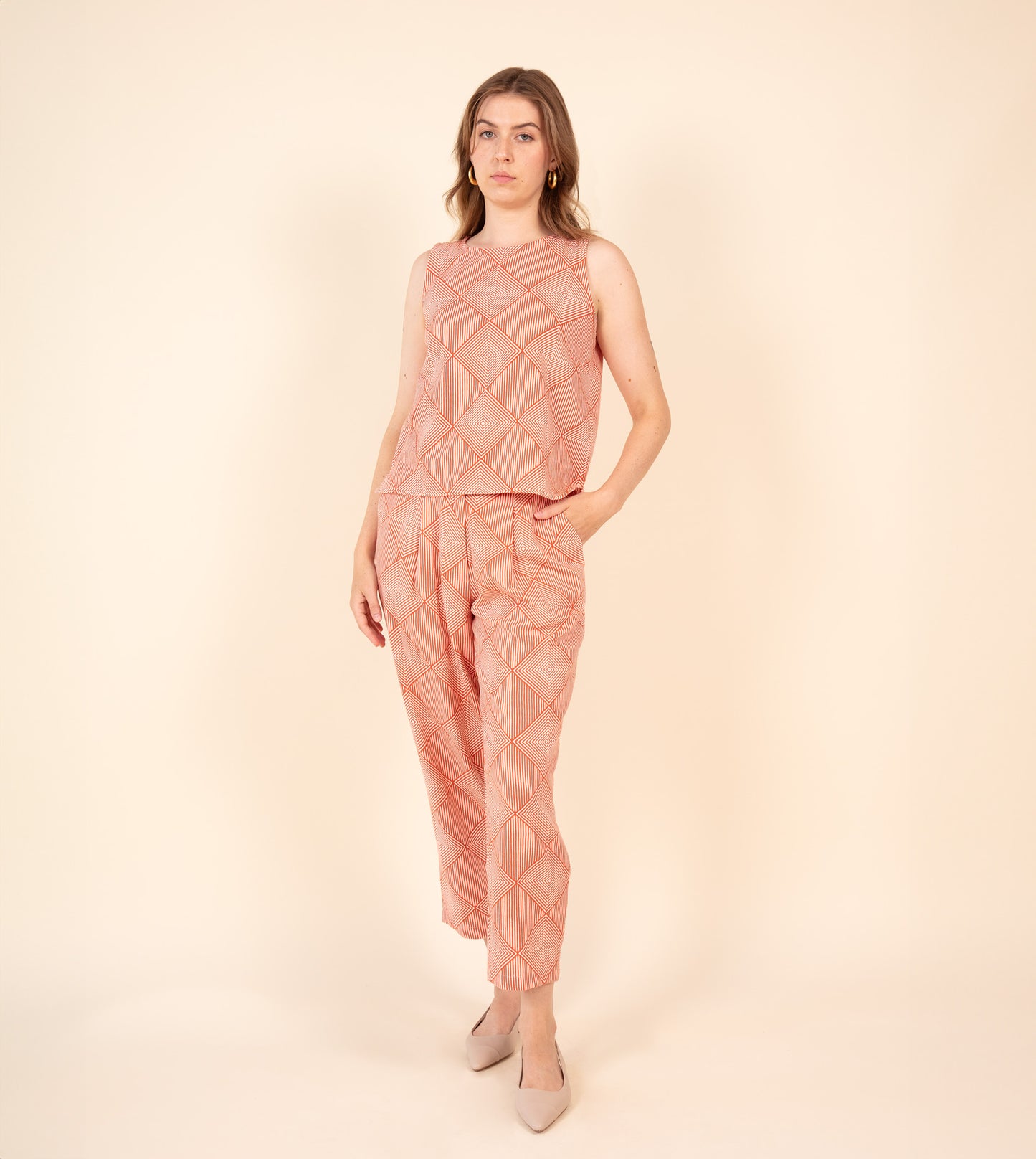 Radiate Akira Top Orange | Harkoi Studio - Elevating traditional patterns with a modern edge, the Radiate Akira, a sustainable- with precision and care. Keywords: radiate, akira, top, orange, sustainable orange, eco-friendly fashion, top.