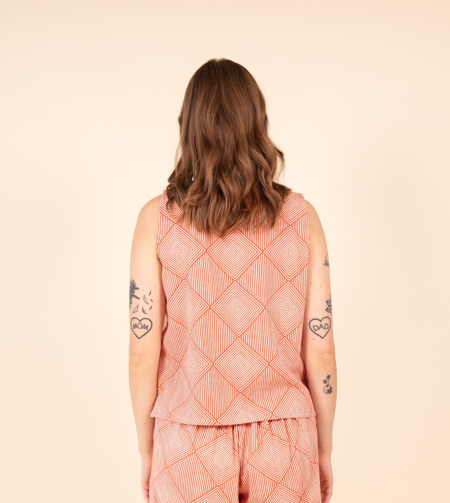 Radiate Akira Top Orange | Harkoi Studio - Elevating traditional patterns with a modern edge, the Radiate Akira, a sustainable- with precision and care. Keywords: radiate, akira, top, orange, sustainable orange, eco-friendly fashion, top.