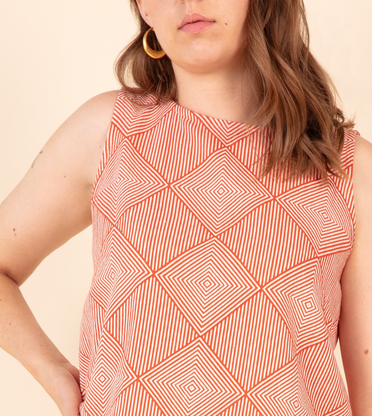 Radiate Akira Top Orange | Harkoi Studio - Elevating traditional patterns with a modern edge, the Radiate Akira, a sustainable- with precision and care. Keywords: radiate, akira, top, orange, sustainable orange, eco-friendly fashion, top.