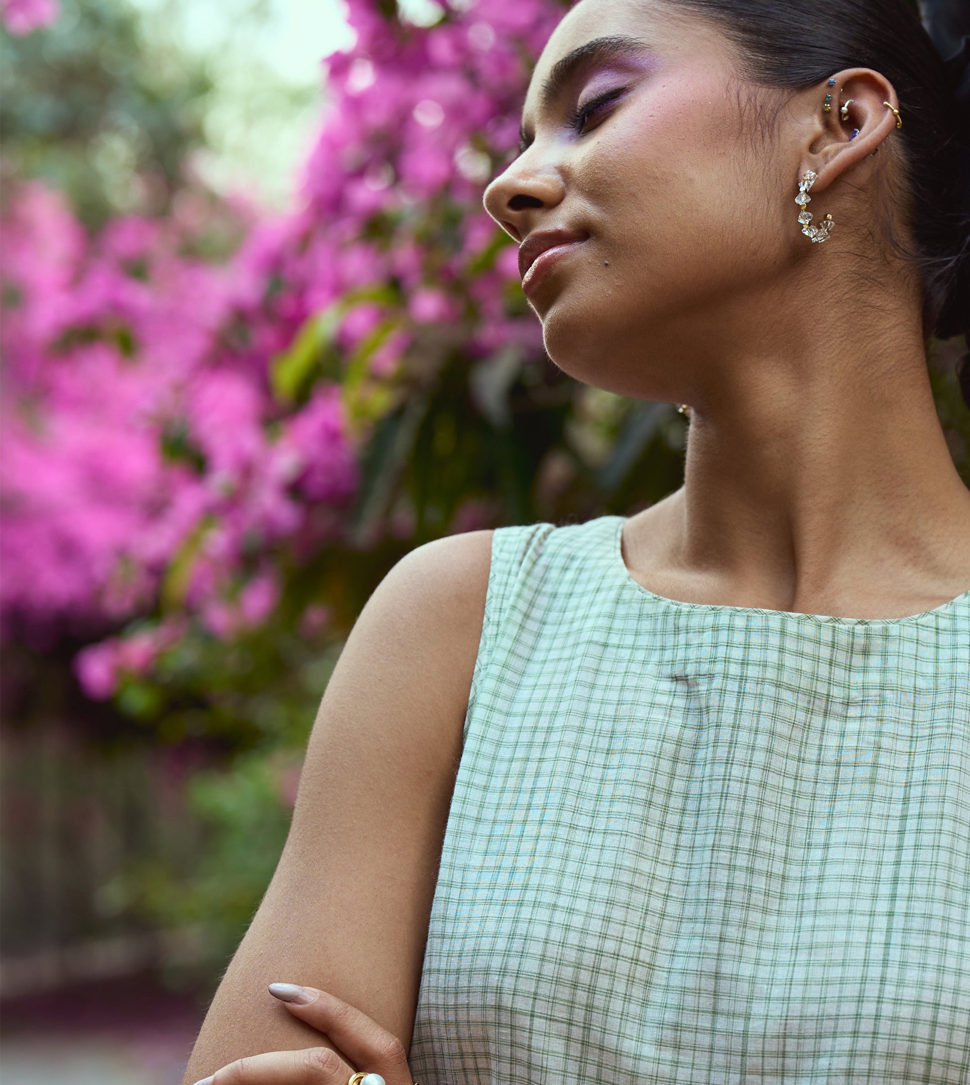 Sleeveless khadi cotton midi dress with sketchy check embroidery and hand-stitched motif, handcrafted in India.