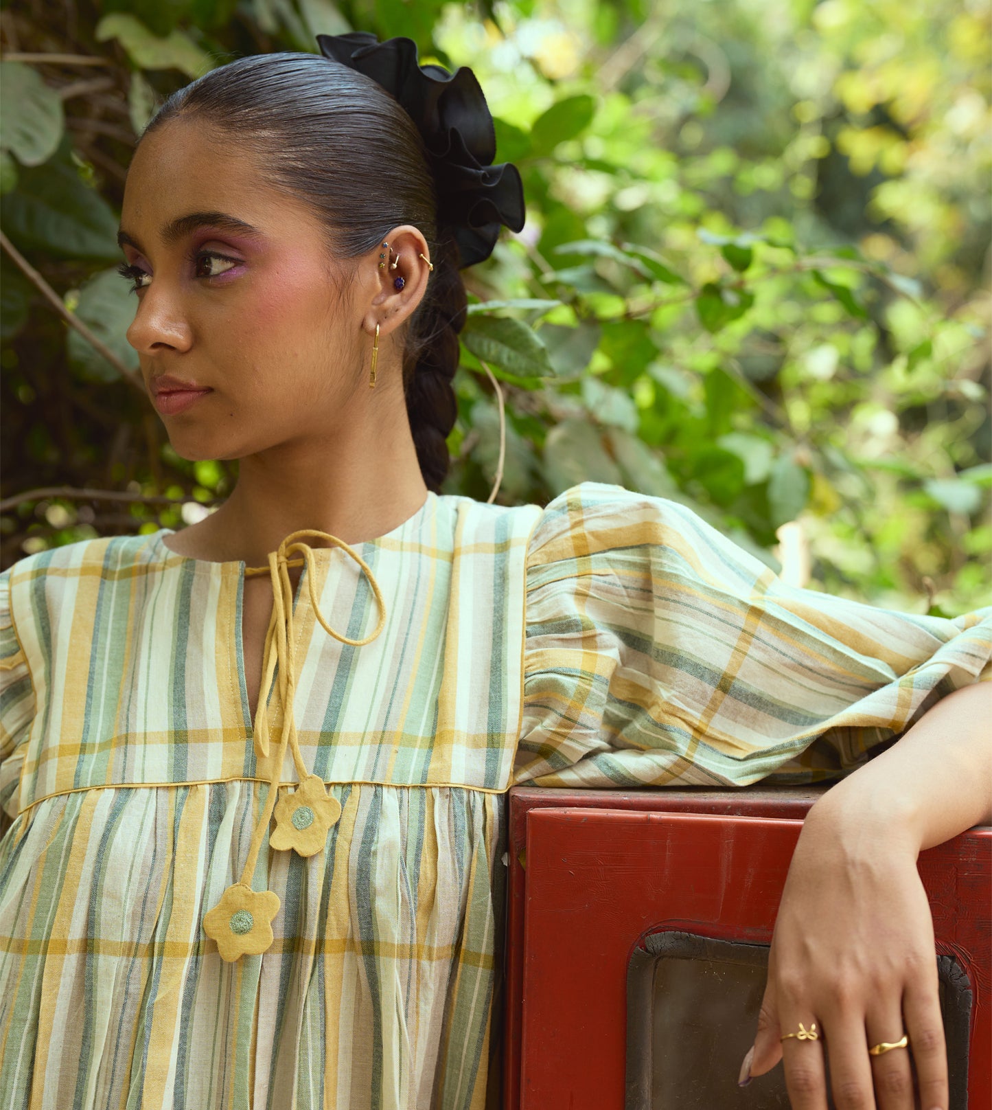 Striped khadi cotton dress with flower-tasseled ties and ¾ sleeves, offering a relaxed and elegant silhouette.
