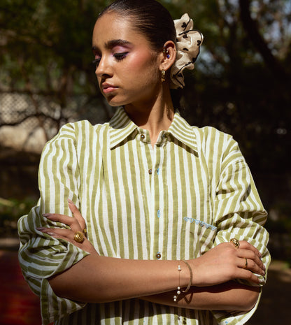 Block-printed striped kala cotton shirt with brass buttons, blue embroidery, and a relaxed fit.