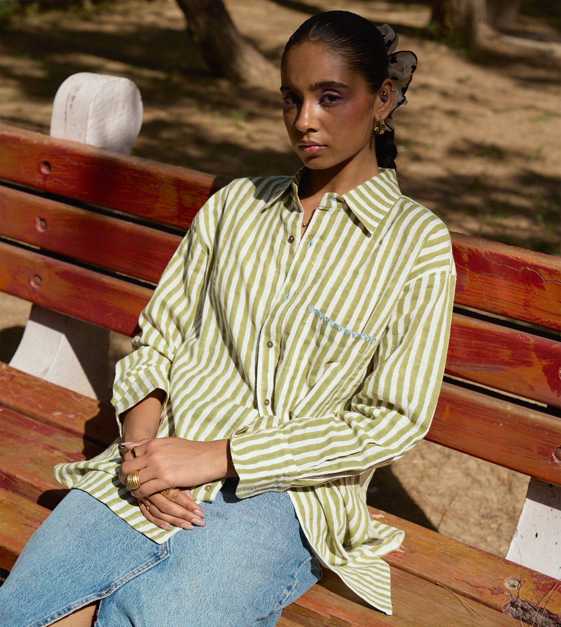 Block-printed striped kala cotton shirt with brass buttons, blue embroidery, and a relaxed fit.