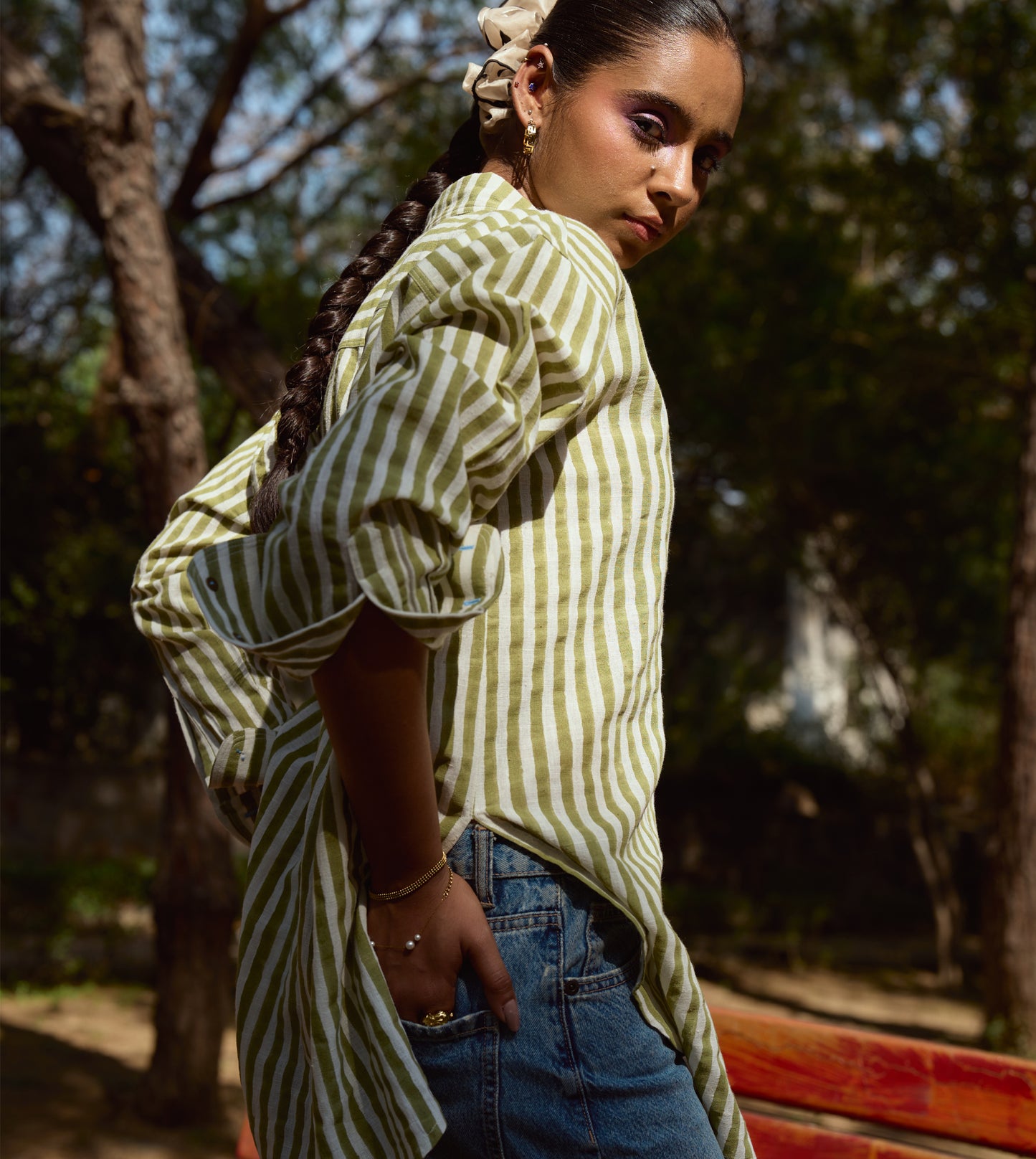 Block-printed striped kala cotton shirt with brass buttons, blue embroidery, and a relaxed fit.
